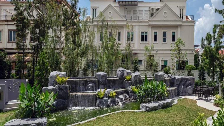 Whispering pond with waterfall in the Stone Garden zone at Belgravia Ace